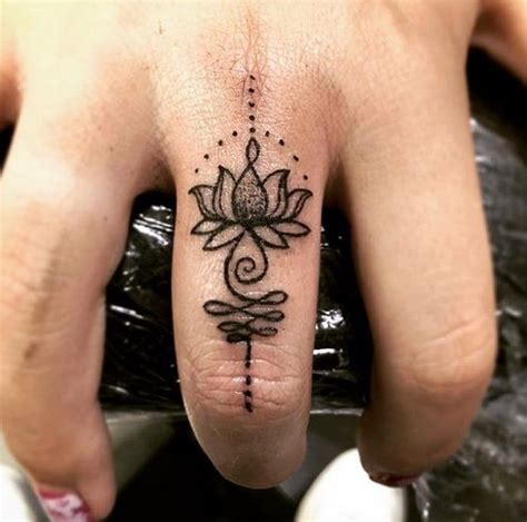 Lotus tattoos are listed some of the most universal tattoo designs those are all the rage unbiased sexual characteristics. Simple Black and White Lotus Unique Finger Tattoo Design ...