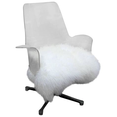 The faux fur offers warmth and comfort to any seat, while the microsuede backing keeps the chair pad from slipping and sliding. Luxe Lucite and Mongolian Sheepskin Swivel Lounge Chair ...