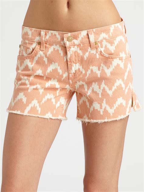 Learn more about sustainable for all mankind: 7 For All Mankind Printed Ikat Cut Off Shorts in Coral ...