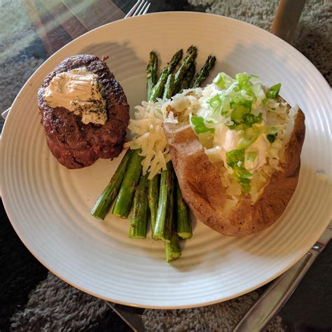 Beef tenderloin is the perfect cut for any celebration or special occasion meal. Homemade Beef tenderloin with peppercorn goat cheese, grilled asparagus and a baked potato : food