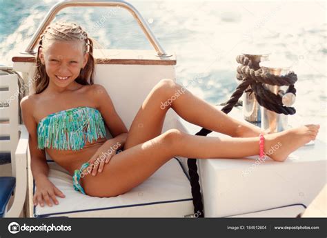 Melanie river had just turned ten years old, but she had never been to school. Cute Smiling Little Girl Enjoying Deck Cruise Sunbathing ...