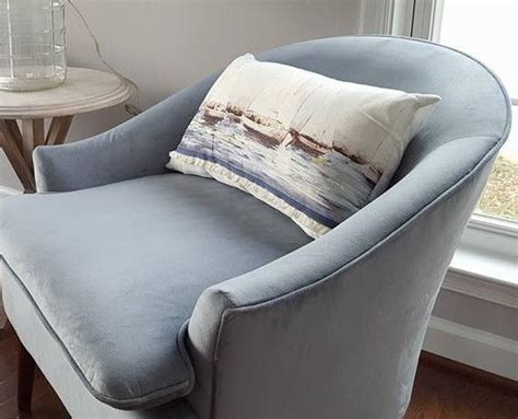 Accent chairs are more than just a pretty seat. Nautical Sailboat-print kidney pillows absolutely finish ...