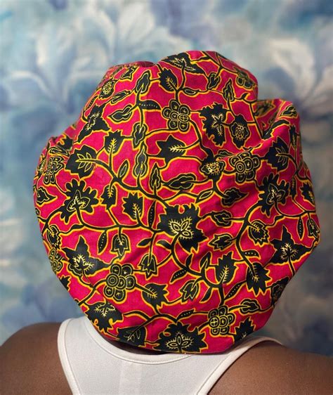 With the right accessories, you can make every day a good hair day. Look cute at home with this red silk hair bonnet. The ...