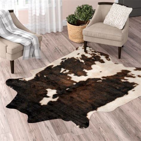 This butter cowhide rug does have a very light mocha brown shade across the entire rug. Binx Faux Cowhide Beige/Brown Area Rug in 2020 | Area rugs ...