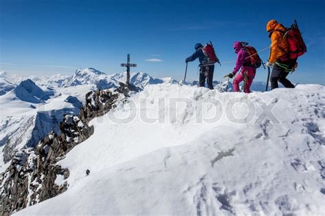 Check spelling or type a new query. Group of climbers on a summit ridge | Stock image | Colourbox