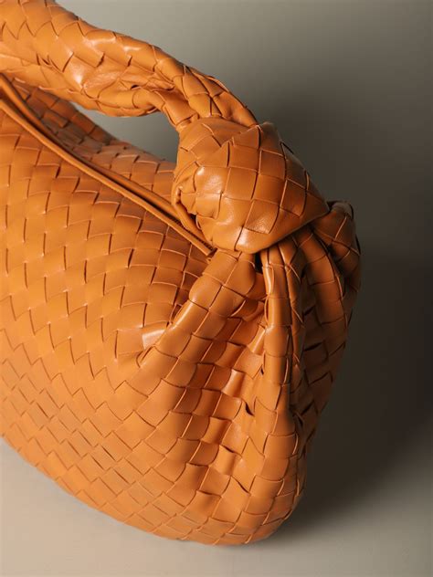 The undyed, natural grass gives the tote a neutral look, highlighting the woven texture. BOTTEGA VENETA: Jodie hobo bag in woven leather | Shoulder ...