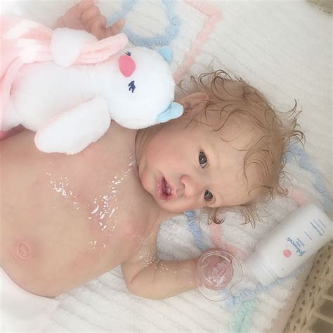 Rinse your baby with cups of water throughout the bath to keep her warm. Fresh from her bath and smelling like baby powder ...