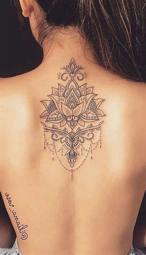 A henna tattoo is a type of a tattoo that is usually temporary. beautiful mandala lotus back tattoo ideas for women spine ...