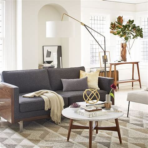 Its marble top, solid wood legs and brass ferules give it a luxe look. Reeve Mid-Century Coffee Table - Marble | west elm