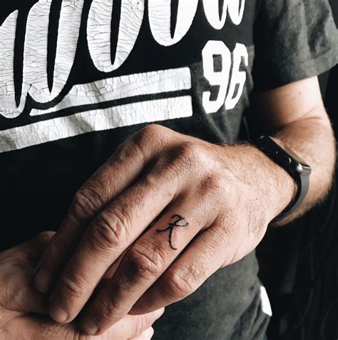 Another small arrow tattoo on the forearm. Men's Wedding initial ring tattoo 🖤 K 🖤 | Ring tattoos ...