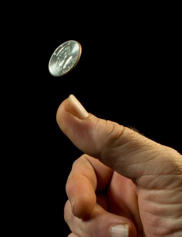 Best price guaranteed simple licensing. Close Up Photo Of A Hand Flipping A Coin In Mid Air Stock ...
