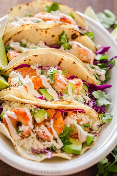 Light flavors, perfect for grilling season and beyond! Shrimp Tacos are loaded with shrimp, cabbage, avocado ...