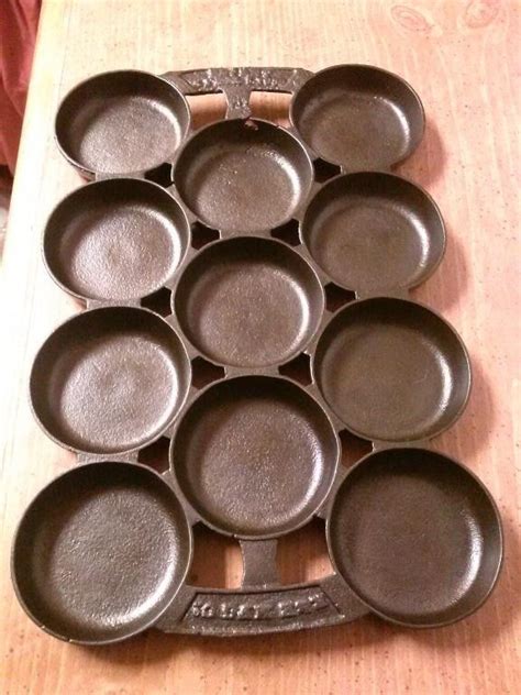 The cast iron muffin pan will not fit into a 10 dutch oven. Antique Cast Iron Gem / Muffin Pan #2 by "R & E MFG. CO ...