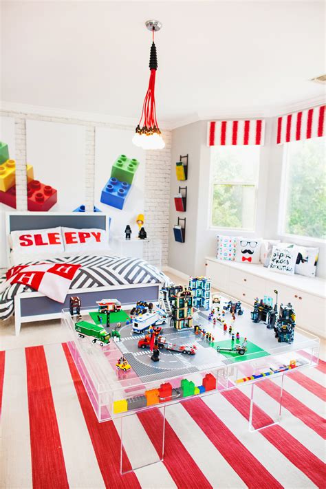 If you possess artistic talent you can diy this wall mural or hire someone to paint a fun lego design for you. Kendra Wilkinson's Son's Lego Themed Room - Project Nursery