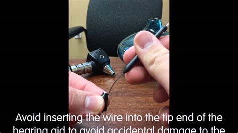 The cleaning tool for bte hearing aids has a brush on one end and a long wire on the other. How to clean your custom hearing aids - YouTube