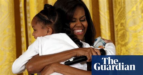 Above, michelle obama wears the abnormal pagan cross. Michelle Obama hugs it out with children at the White House - in pictures | US news | The Guardian