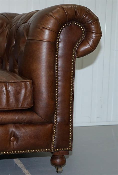 We are delighted to offer for sale this lovely original timothy oulton aged brown leather chesterfield three seater sofa with huge deep heavy feather filled cushions rrp £4499. Stunning Timothy Oulton Westminster Brown Leather ...