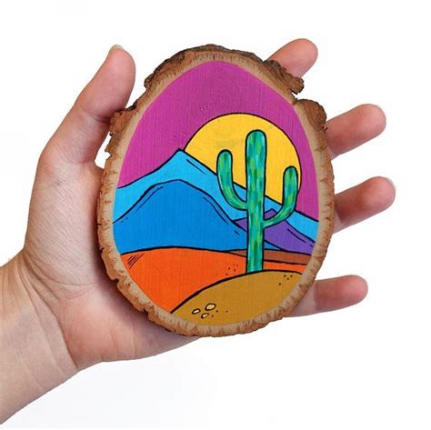 New users enjoy 60% off. Desert Christmas ornament on a wood slice, colorful ...