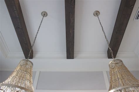 So we engineered some metal straps/brackets out of cleats. DIY Faux Beams in my Dining Room in 2020 | Faux ceiling ...