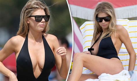 To have fling at smb/sth: nice Charlotte McKinney flashes nipple as she suffers racy ...