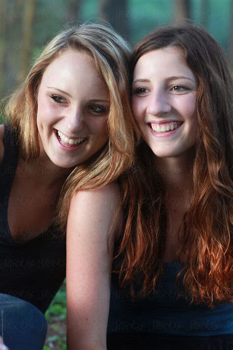 "Two Beautiful Teen Girls Laughing Outdoors" by Stocksy Contributor