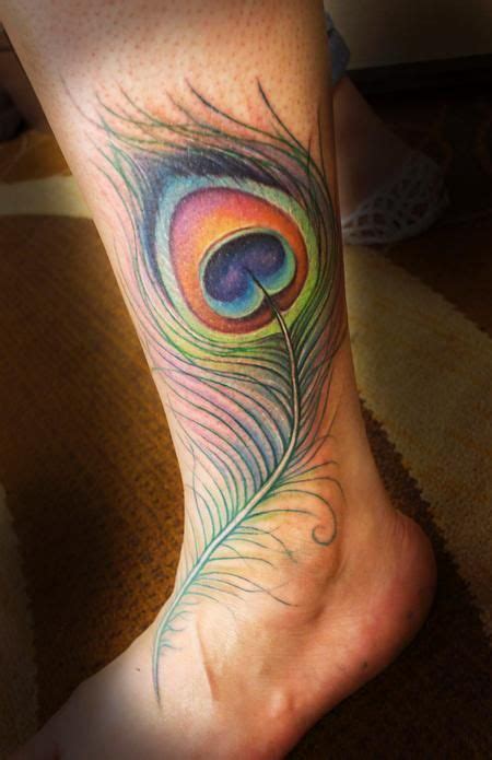 A feather tattoo is meant to represent beauty, and having a positive attribute. 20 Peacock Feather Tattoos And The Beautiful Meanings ...