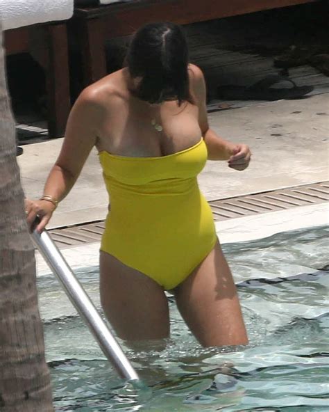 B.when he arrived at the pool , he realize he haven't brought his swimsuit. Kourtney Kardashian: Yellow Swimsuit at the pool -11 ...