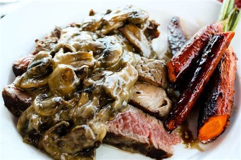 Rich ribeye steaks are served with mushrooms in a tart balsamic vinegar sauce. Grilled Ribeye Steak with Mushroom Sauce | Girl Gone ...