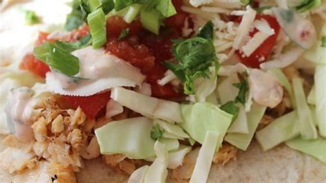 Make these classic baja tilapia fish tacos at home and serve with fresh lime, avocado and cabbage for an authentic socal taste. Savory Tilapia Fish Tacos | Simple Eats