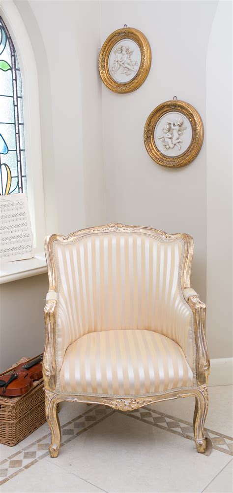 Rated 4.5 out of 5 stars. French style armchair with striped design and gilded frame ...