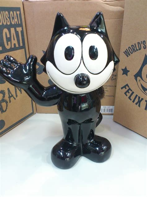 An anthropomorphic black cat with white eyes, a black body, and a giant grin. FELIX THE CAT セラミック貯金箱 | 看板の桃太郎ブログ