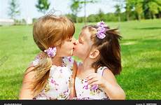 kissing sisters lightbox bigstockphoto