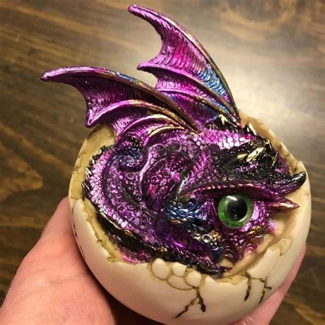 Which is the best dragon statue to buy? Purple Baby Dragon Hatching From Cracked Egg Figurine ...