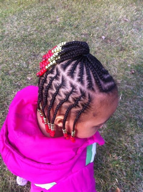 Cornrows with beads make the simple bun look more intriguing. Sophie Mbeyu Blog: STYLE ZA NYWELE KWA WATOTO!