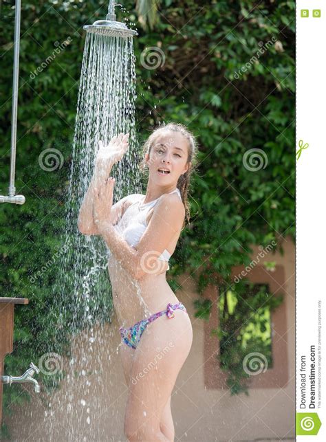 Opt to diy (do it yourself) for more fun together. Girl Wear Bikini Standing Under The Outdoor Pool Shower ...