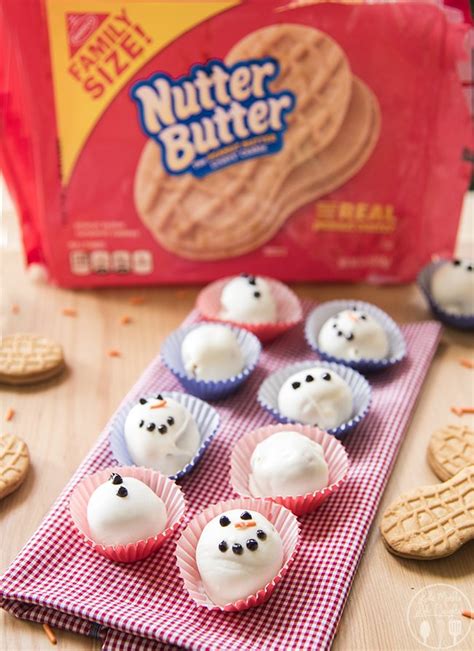 Nutter butter truffles are made from cookie crumbs, cream cheese, and peanut butter. Nutter Butter Snowman Truffles - LMLDfood