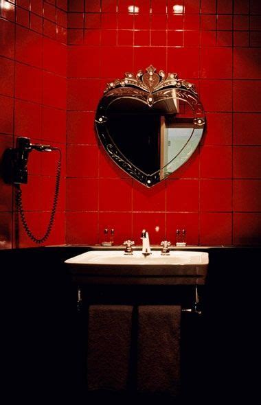 Our bathroom mirror was just plain and lacked that wow factor! Dark painted bathroom with contrast splashback tiling in ...