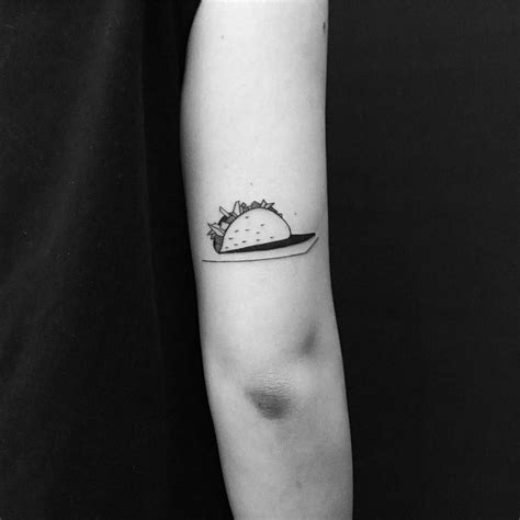 A simple black triangle tattooed on the right wrist by @tattooist_flower related tattoos. Black and white taco tattoo by Chinatown Stropky in 2020 | Taco tattoos, Tasteful tattoos, Tattoos