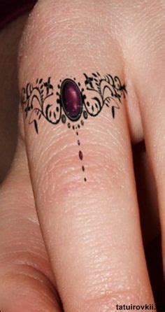 Name on finger tattoos done by kristin inkaholics gainesville ga. wedding ring tattoo - Szukaj w | Ring tattoo designs, Ring ...