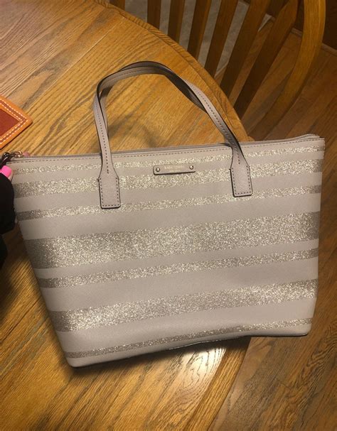 Maybe you would like to learn more about one of these? Cute striped glitter purse from Kate spade. 9" height, 11 ...