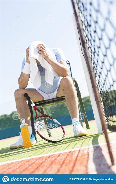 The dimensions of a tennis court are defined and regulated by the international tennis federation(itf) governing body and are written down in the annual 'rules of tennis' document. Full Length Of Exhausted Mature Man With Head In Towel ...