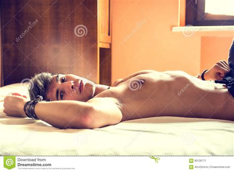 If you are looking for models/bedroom teen bedroom you've come to the right place. Shirtless Male Model Lying Alone On His Bed Stock Image ...