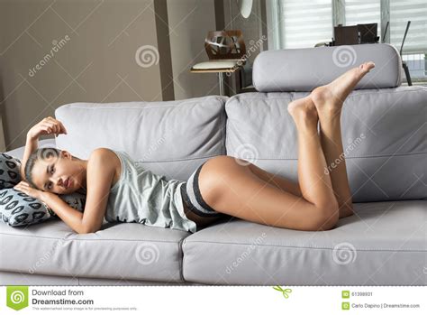 Oh, no, i'm going home. Female lying on sofa stock image. Image of caucasian ...