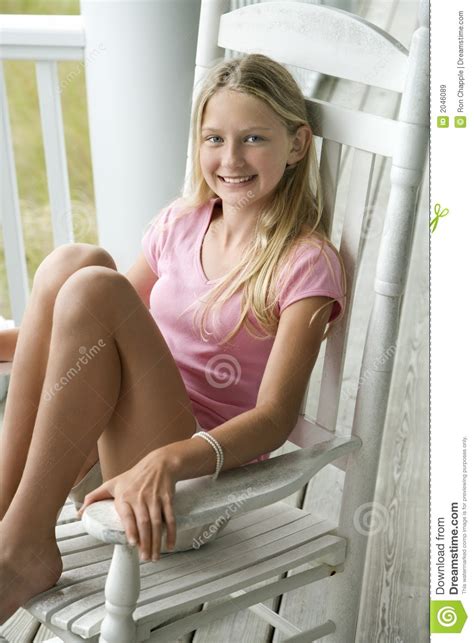 I love this song, it's one of my favorites! Girl sitting in chair stock image. Image of chair ...