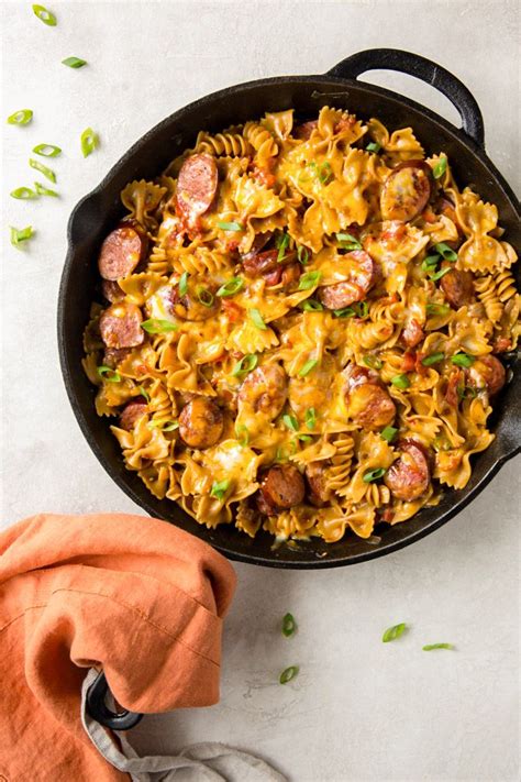 Bring the mixture to a boil, cover, and reduce heat to low. On Pan Cheesy Smoked Sausage Pasta Skillet | Recipe ...