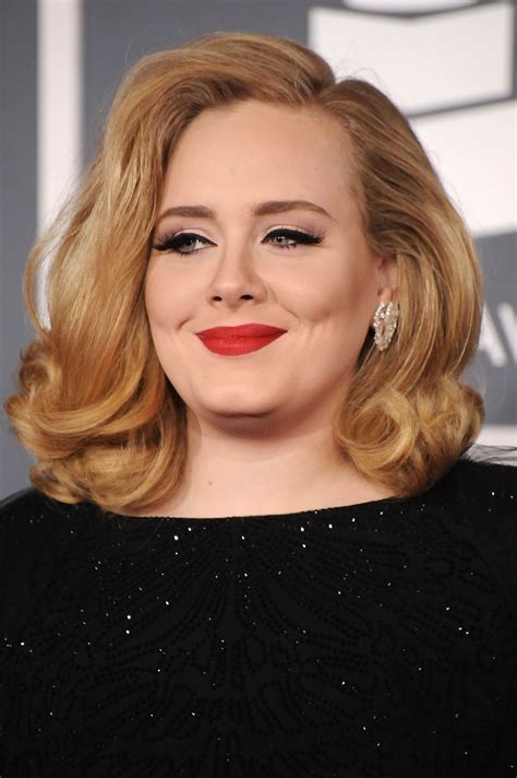 Adele with red lipstick at the Grammys. | Adele Hits the Red Carpet Ahead of Her Grammys 