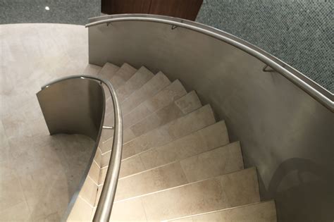 For use in structurally sound staircase framing. Contemporary, curved stainless steel staircase for high end residential spa