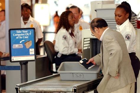 Put the phone in your pocket, and walk through the metal detector. Traveler Strips to Get Through Airport Metal Detector