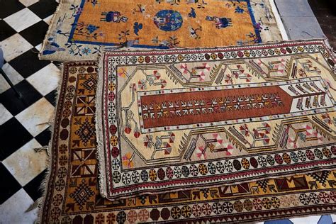 Afghan carpet rugs are textile floor coverings that give a homely and pleasant feel to the rooms. Two Afghan Carpets - Shapiro Auctioneers