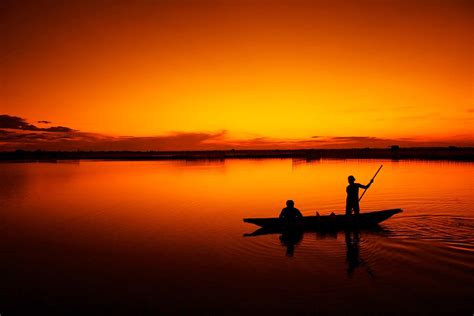 Have you ever imagined to lock your phone with a zip as you lock your bags. silhouette of two men on canoe during sunset #fishing # ...